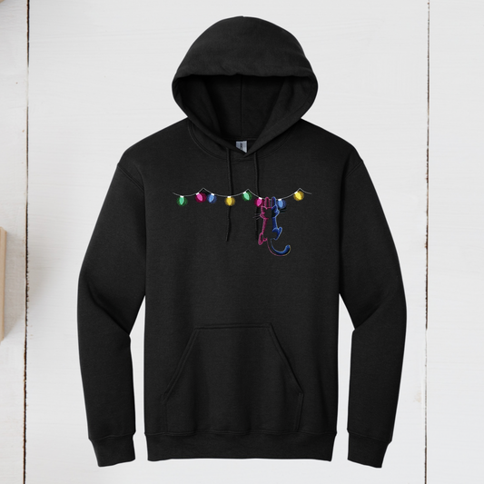 Kitty Hanging On Christmas Lights